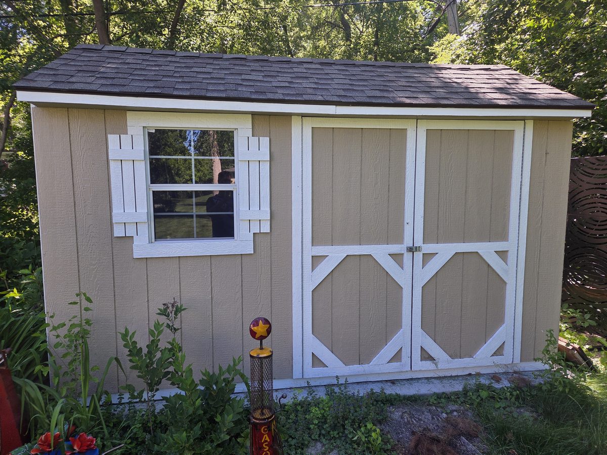 Shed after repainting, new trim and shutters